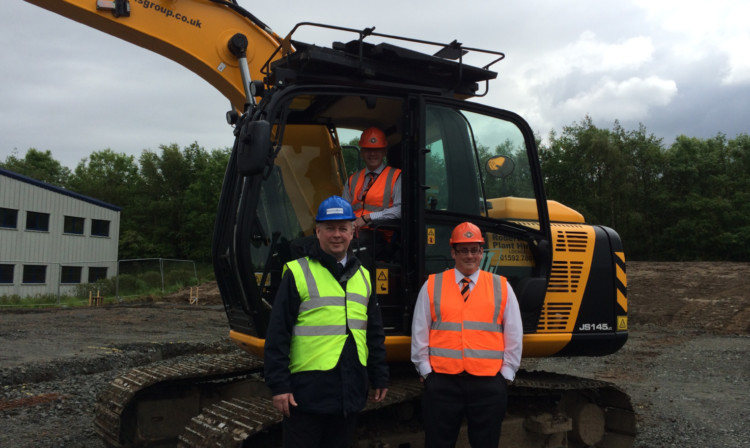 Ewan Cameron with Neil Alexander (in digger) and Stephen Ripley of Eclipse IP.