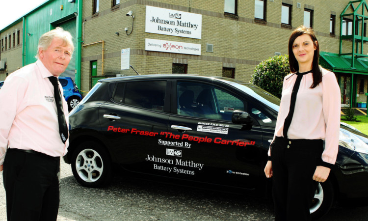 Taxi owner Peter Fraser with Judith Hendry, sales administrator with Johnson Matthey Battery Systems, sponsor of Scotlands first all-electric taxi.