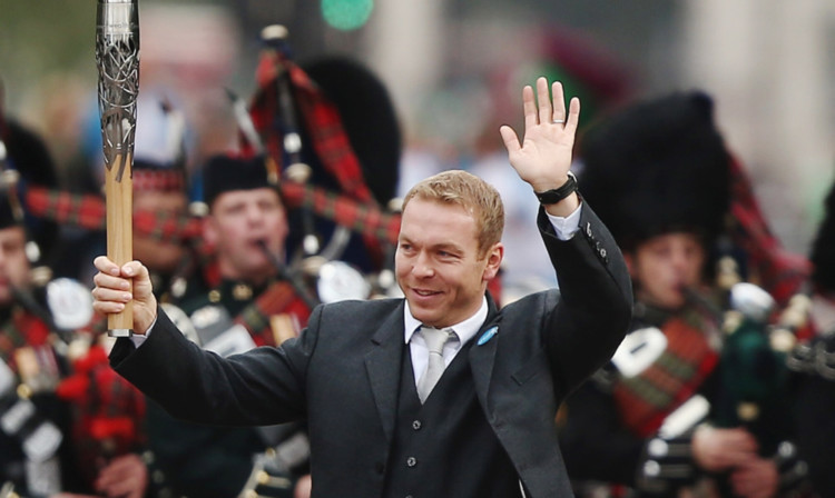 Sir Chris Hoy leads the pipes and drums of the Scots Guards in London during part of the ceremony to launch the Queens Baton Relay.
