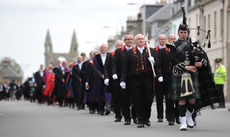 The graduation parade makes its way along North Street.