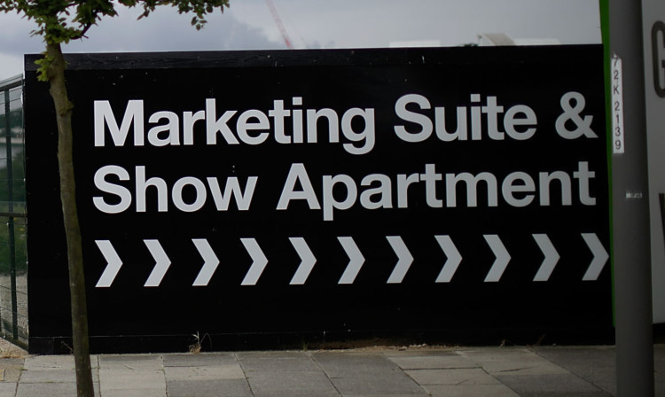 LONDON, ENGLAND - JUNE 04:  Sales and marketing signs for new build apartments and houses in Greenwich Millenium Village on June 4, 2014 in London, England. Mark Carney, Governer of the Bank of England has signalled worries with the housing market, pointing out that far too few homes are being built. Today, finalists were announced in a competition to design new garden cities outside of London to provide jobs, homes and economic growth in new places as the capital runs out of room for new property.  (Photo by Matthew Lloyd/Getty Images)