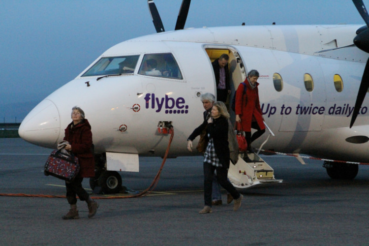 COURIER, DOUGIE NICOLSON, 31/03/14, NEWS.
Pic shows passengers disembarking from the flight from Stanstead at Dundee airport tonight, Monday 31st March 2014.