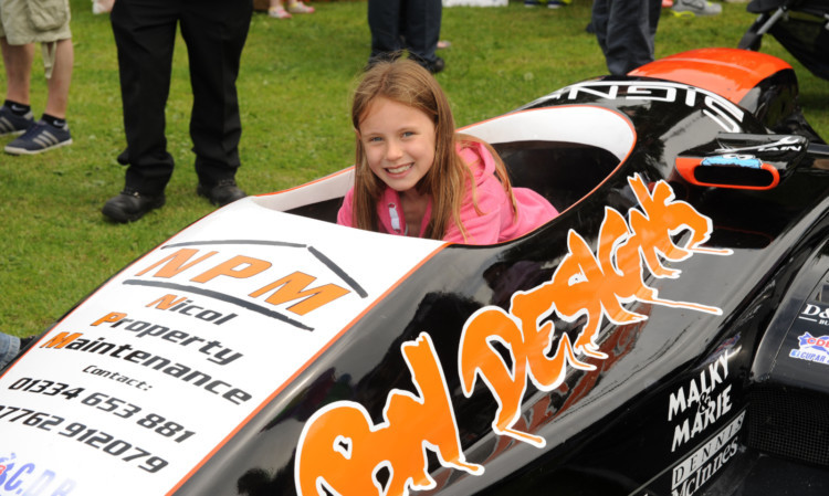 Layna Oliphant checking out a racing car on display at the gala day.