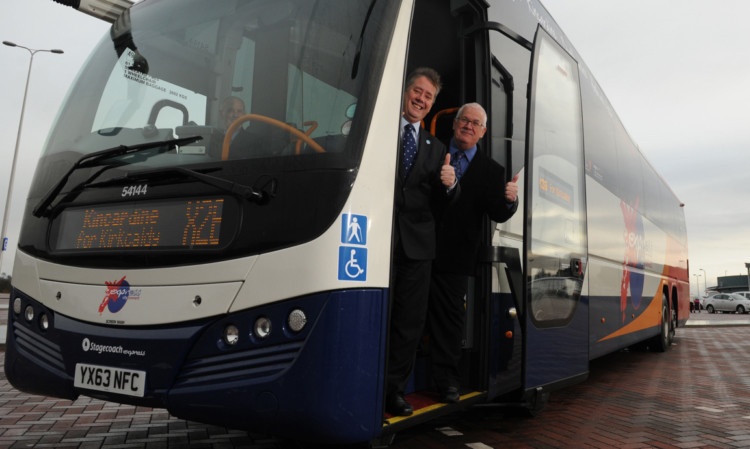 Transport Minister Keith Brown (centre) with driver Brian Hurcombe and Councillor Pat Callaghan at the opening of the Halbeath Park and Ride last November.