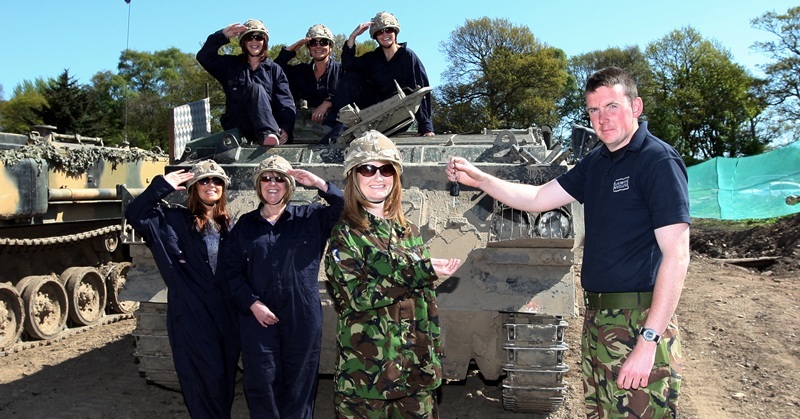 Steve MacDougall, Courier, Tank Driving Scotland, Auchterhouse. Private Benjamins Charity Tank Driving. Pictured, at the front, left to right is Kay Welsh, Barbara Butchart, and Pamela Walker, accepting the keys (prop only!) from Paul Danks (of Tank Driving Scotland). Back row, left to right is Lynda Mulholland, Karen Purves and Maureen Lindsay.