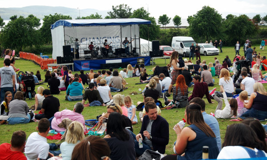 The crowds enjoy music on the main stage on Magdalen Green.
