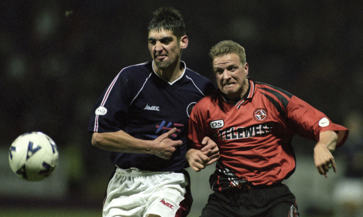 Dundee's Robbie Raeside battling for the ball against Dundee United's Alex Mathie in 1998.