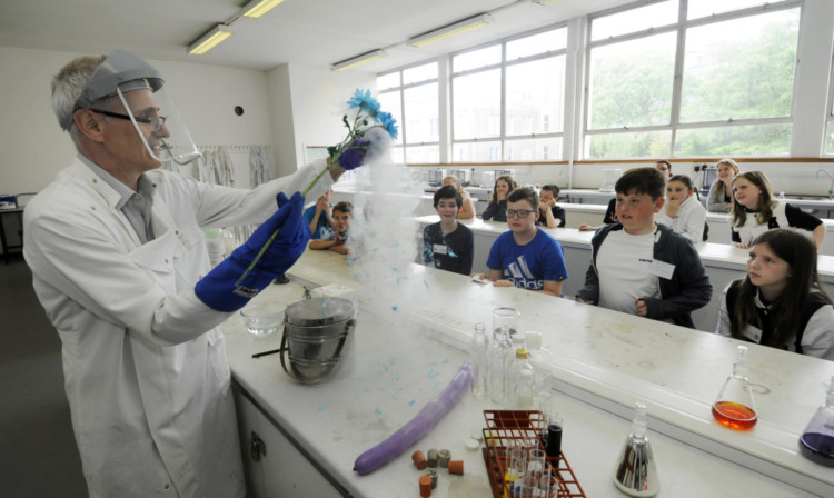 Dr Alan Bruce conducts an experiment with liquid nitrogen.