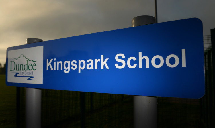 Kim Cessford - 29.04.14 - pictured with 'dramatic' lighting is one of the entrance signs at Kingspark School, Dundee