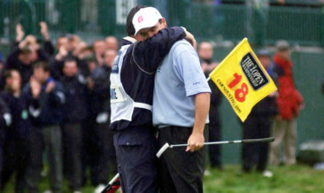 Home favourite Paul Lawrie is embraced by his caddie after winning the Open at Carnoustie in 1999.