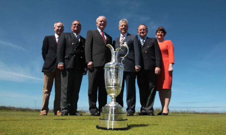 At the announcement at Royal Portrush are, from left, club captain Simon Rankin, Peter Unsworth, Northern Ireland Deputy First Minister Martin McGuinness, First Minister Peter Robinson, Peter Dawson and Enterprise Minister Arlene Forster.