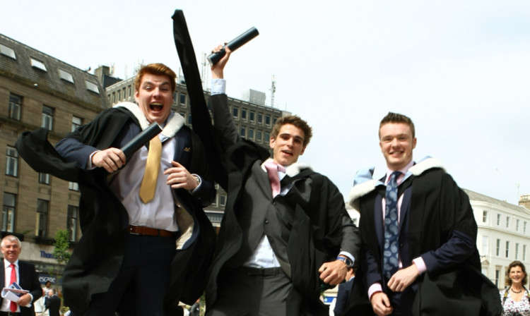 Accountancy graduates Nicholas Mawhinney, Howell Craske and Josh McLuskey celebrate their graduations.