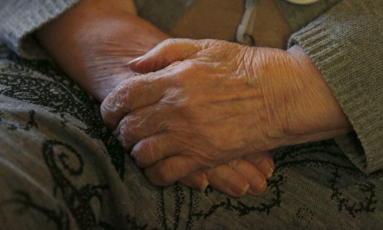 An elderly person at a charity tea party in London. PRESS ASSOCIATION Photo. Picture date: Sunday February 23, 2014. Photo credit should read: Jonathan Brady/PA