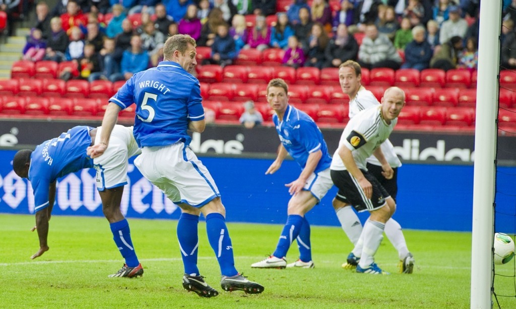 Frazer Wright heads St Johnstone into the lead against Rosenborg. 