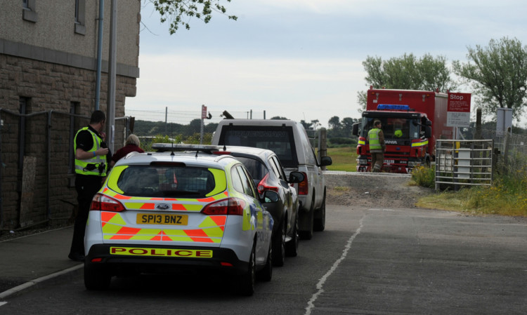 The emergency services near the scene on Monday.