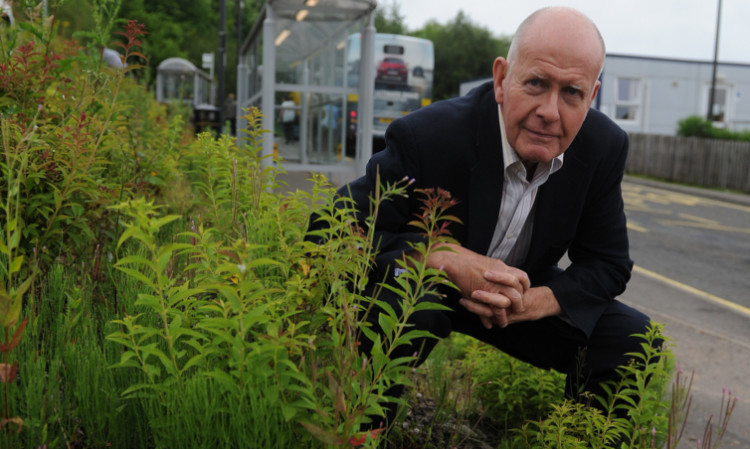 Councillor Willie Wilson at Broxden park and ride, which has been criticised for the state of its green spaces.