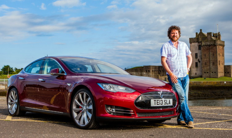 Chris van der Kuyl arrives back in Dundee with his new Tesla.