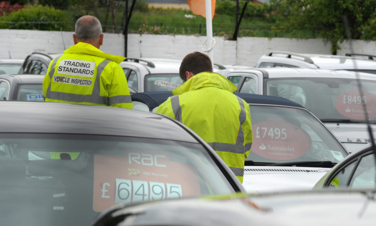 Trading Standards officers at Glencross Motors earlier this month.