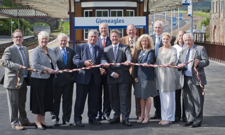 Keith Brown, centre, is joined by officials, dignitaries and, second and third from left, Provost Liz Grant and council leader Ian Miller at the new-look station.