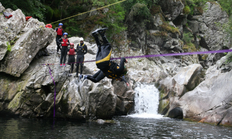 Would-be aqualiners queue up to try and cross Calvine Gorge.