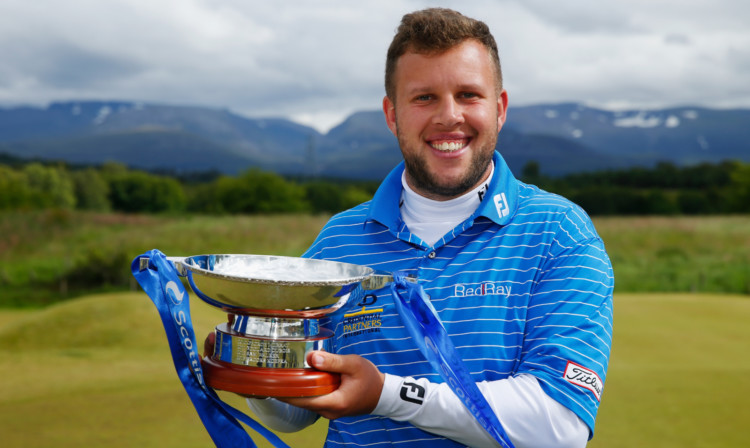 Andrew Johnston of England poses with the trophy after winning the Scottish Hydro Challenge.