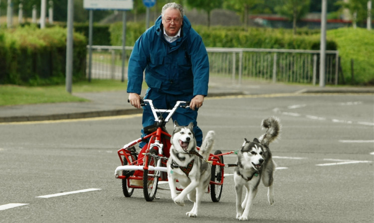 Sandy MacKenzie from Caberfeidh Huskies, with two of his huskies, promoting the 'Ice Station Antartica' exhibition.