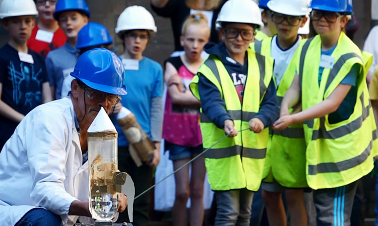 The children watch as their rockets ahead of blast-off.