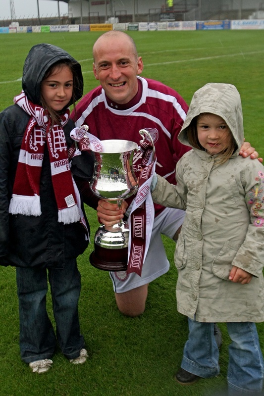 Paul Sheerin and his daughter with the Third Division trophy in 2011. 