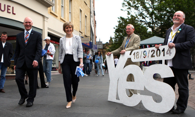 Deputy First Minister Nicola Sturgeon, with MSP Joe FitzPatrick, on a walkabout in Dundee.