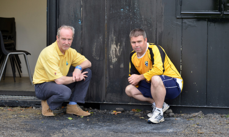 Sad sight: John Beare with Eddie Gibbs from Glenrothes Cricket Club  the scene of more vandalism once again.