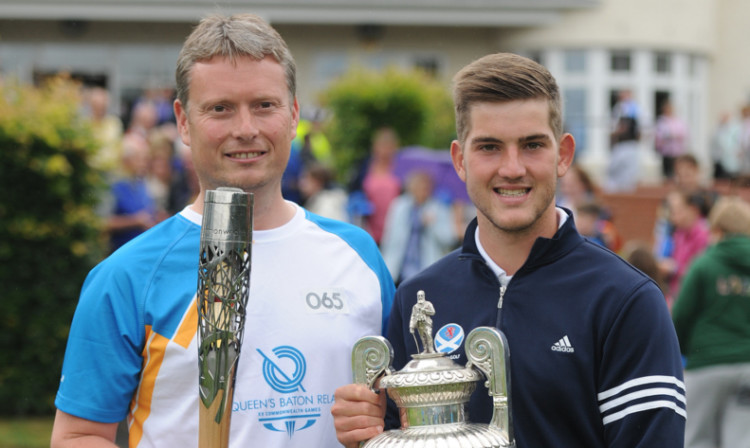 Baton bearer and former Amateur golf champion Stuart Wilson meets new champion Bradley Neil at Blairgowrie Golf Club.