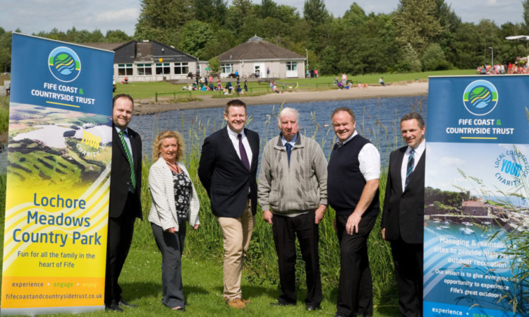 Celebrating the announcement are, from left, FCCT business manager Simon Phillips, councillors Ann Bain, Gavin Yates, Willie Clarke and Alex Campbell and the trusts new Lochore Meadows Country Park manager, Ian Laing.