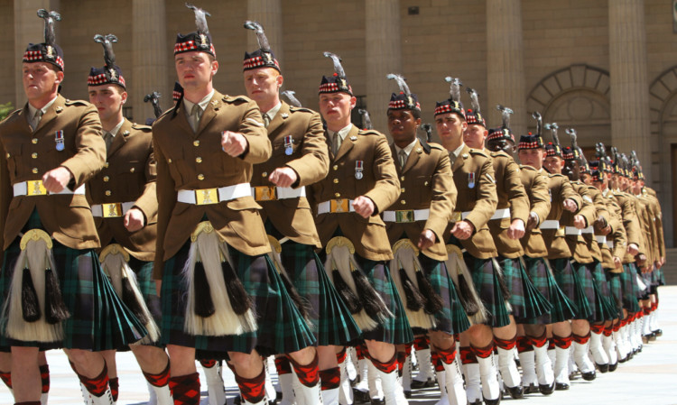 The Highlanders, 4th Battalion the Royal Regiment of Scotland, march out of City Square on Saturday.