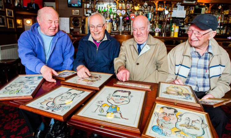 A group of Royal Arch regulars look at the caricatures by Brian Petrie. From left: Ally Macdonald, Bob Blacklaws, George Murray and Charlie Lilburn.