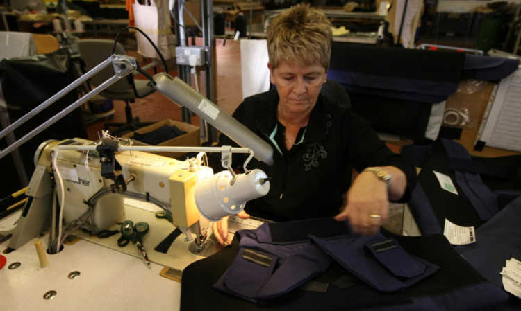 A J&D Wilkie worker making a body protection vest for the firms Jack Ellis range.  The Kirriemuir textile manufacturing firm plans expansion and has received backing from HSBC. The bank has warned Scottish SMEs that they risk missing the boat by failing to bring forward investment plans.