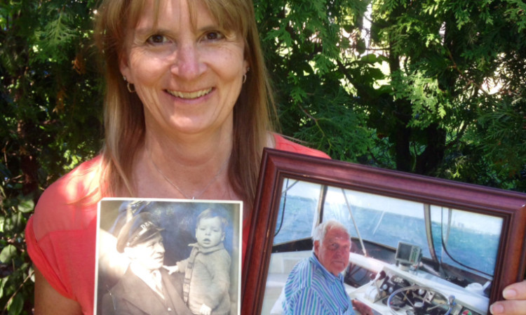 Caroline with two portraits of her father.