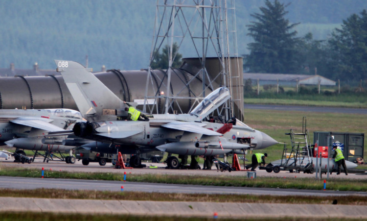 Ground crew working on Tornados at RAF Lossiemouth.