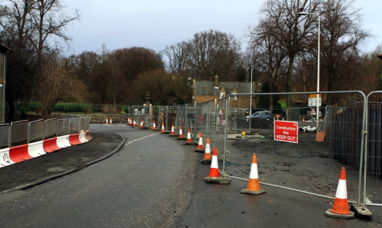 The flood prevention scheme is four years late and £14 million over budget.