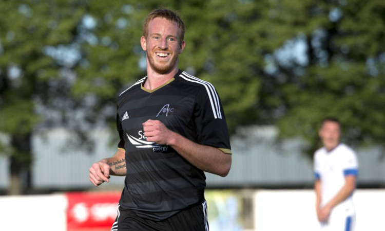 Aberdeen ace Adam Rooney celebrates his early goal.