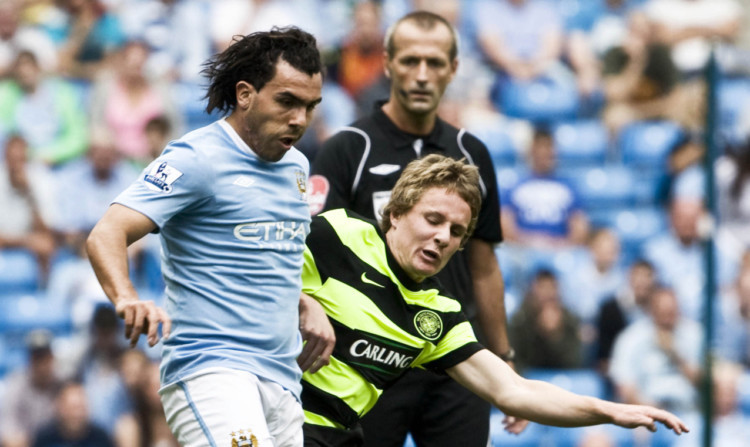 Simon Ferry challenging then City striker 
Carlos Tevez in 2009 while playing for Celtic.