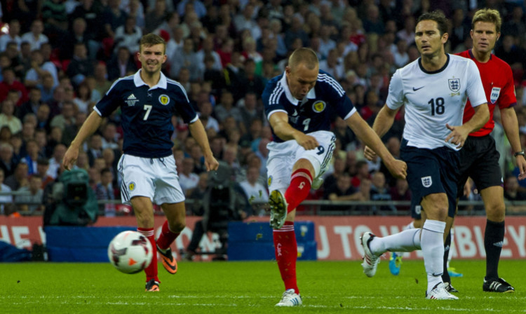Kenny Miller scores for Scotland during the clash at Wembley last August.