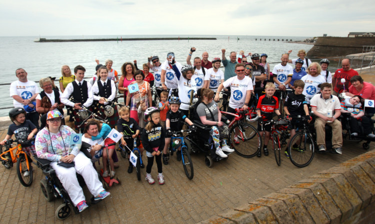 Grant, and some of the people who joined him on stages of his Loo Tour of Britain from Leeds, at Arbroath Harbour.