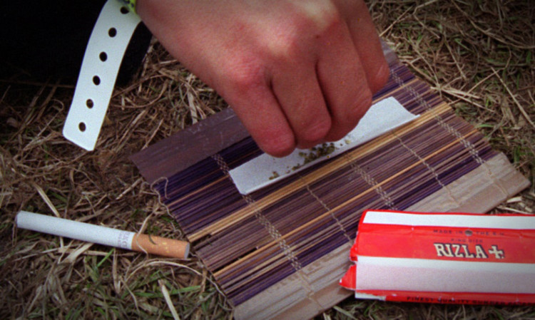 A young person rolling a cannabis joint. (library photo)