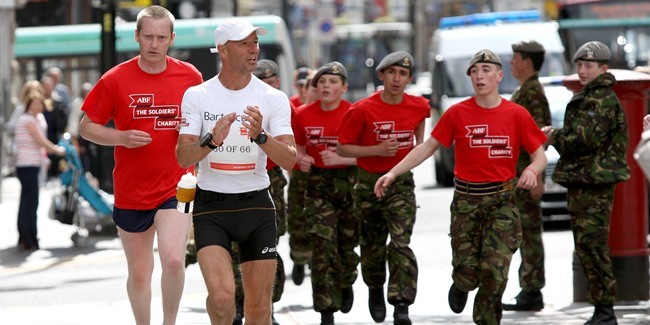 Kris Miller, Courier, 14/05/11. Picture today at Dundee City Centre shows Ultra Marathon runner, Andy McMenemy with some of the cadets who accompanied him on the last part of his 50km run around Dundee. Andy is running 66 Ultra marathons in 66 days to raise money for the ABF.