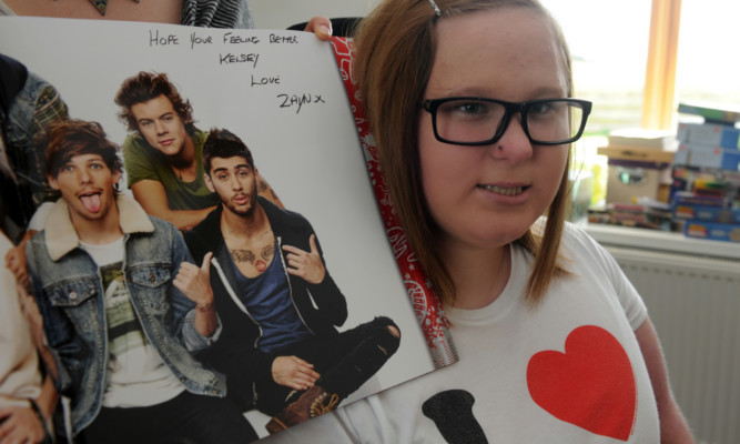 Kelsey Speed with her One Direction programme.