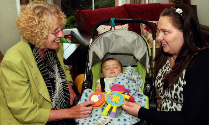 Minister for housing and welfare Margaret Burgess met young homeless mother Gemma Lindsay and her baby son, Charlie, during a visit to Perth on Wednesday.