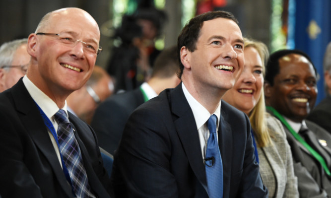 Scottish Finance Secretary John Swinney and George Osborne at the Commonwealth Games Business Conference in Glasgow.