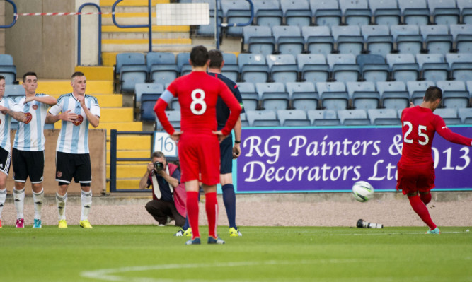 Luka Tankulic (right) scores his second of the match from a free-kick.