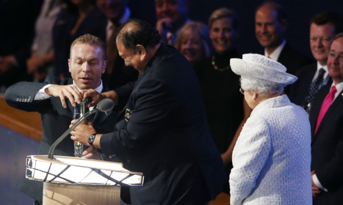 Sir Chris Hoy steps in to help Prince Imran, while the Queen and other VIPs find it all very amusing.