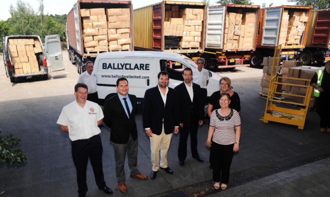 Ballyclare hands over the first batch of pallets to IFRA.